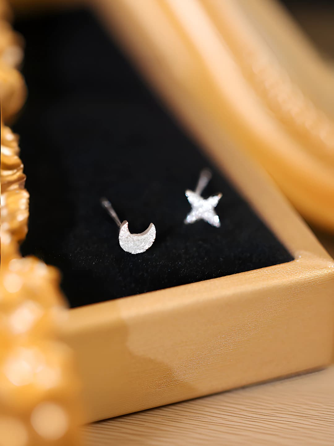 Women's asymmetric star and moon earrings with silver posts