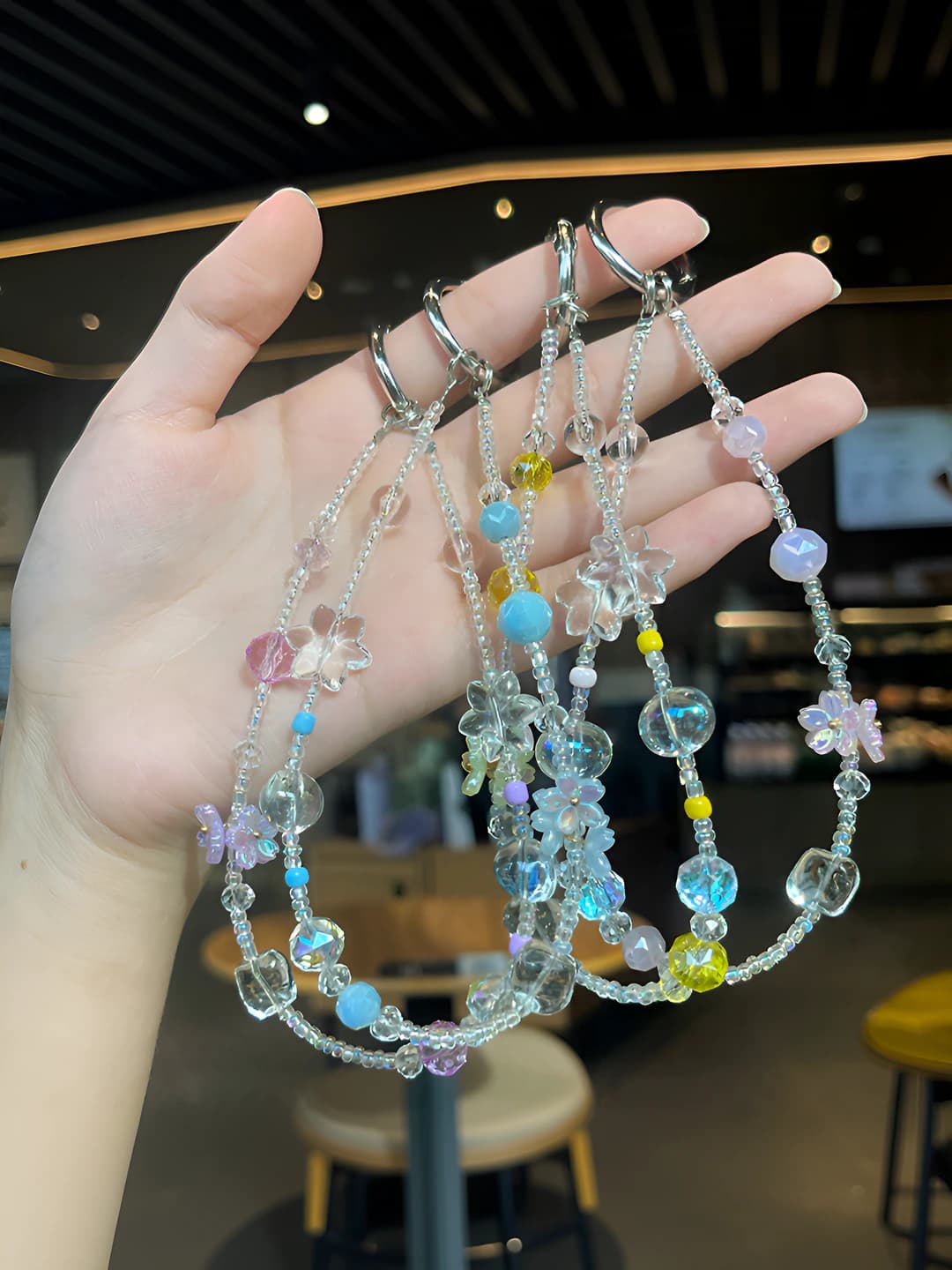 Women's keychain in natural style, handmade, with star, moon, sun, cloud and space pattern, featuring pearl, tulip, shell, baby's breath and Saturn design elements, in a fresh and sweet look