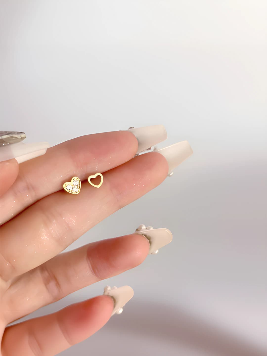 Women's mini heart-shaped stud earrings with zircon on silver posts, asymmetric design, simple modern style