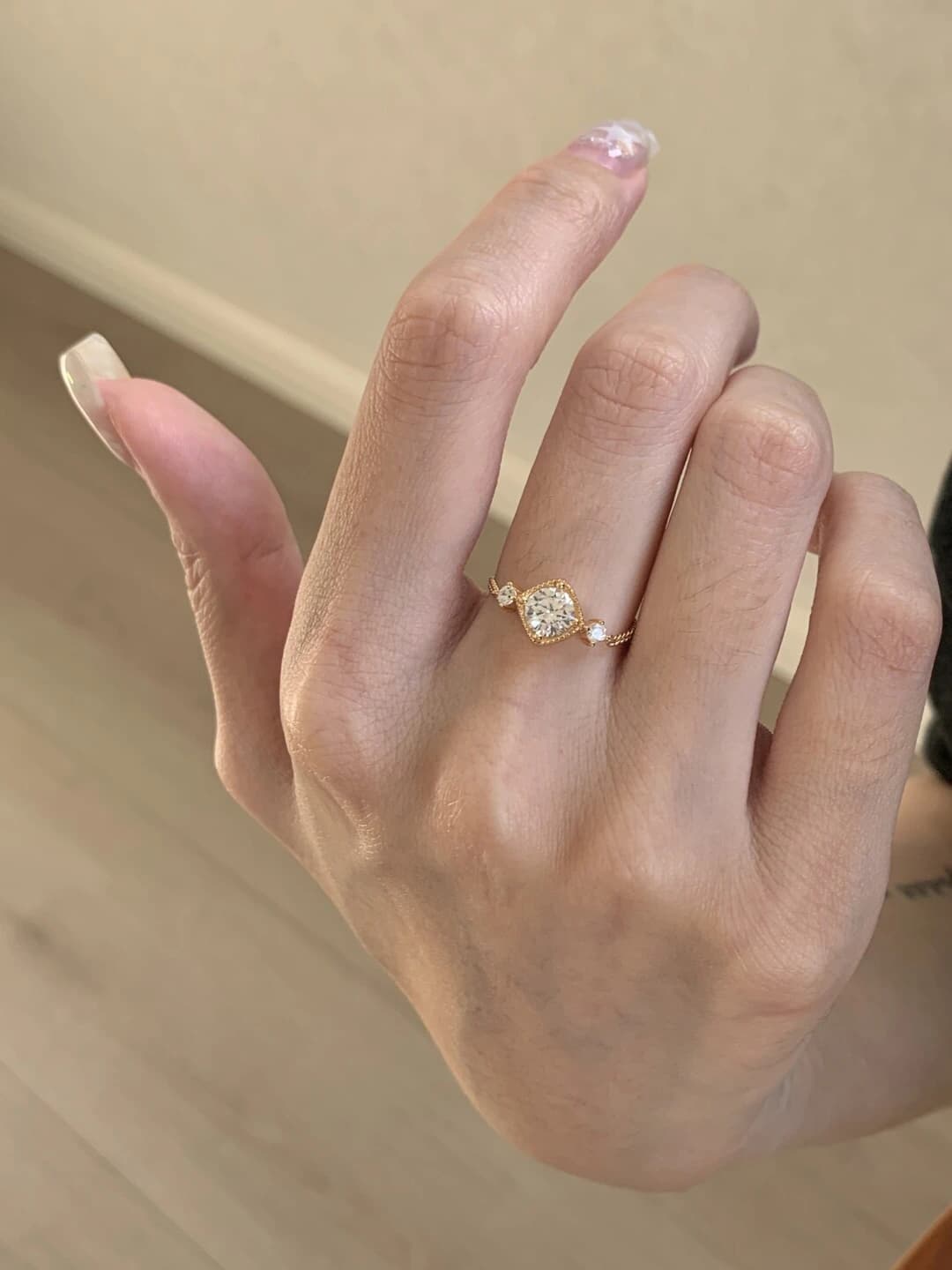 Gold three-stone slide ring