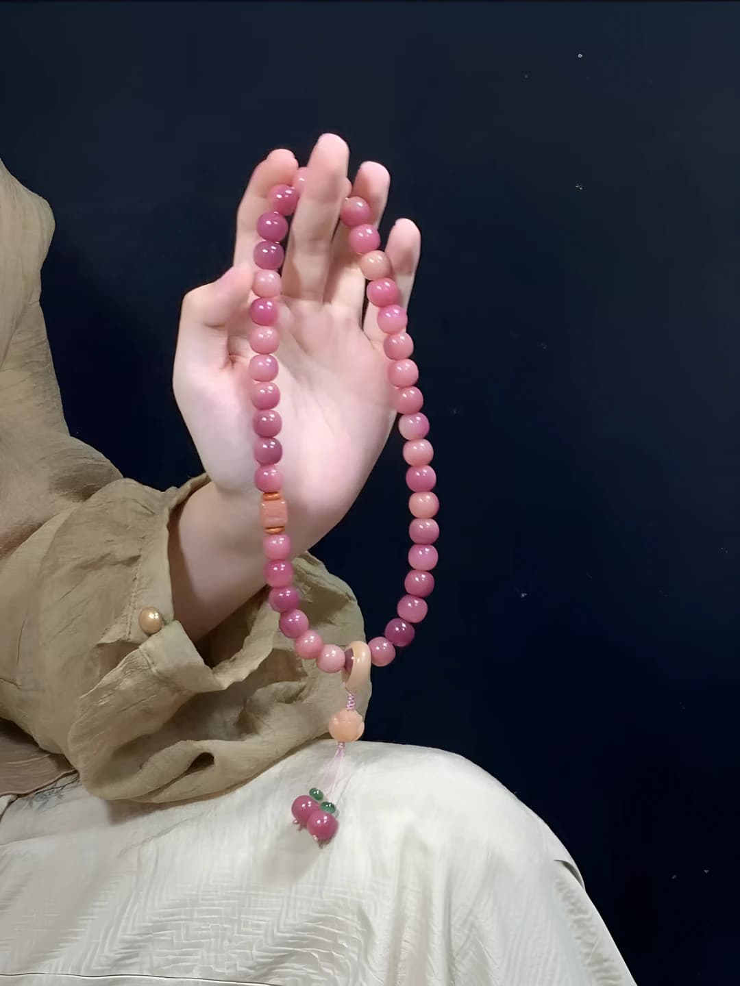 Women's two-strand bodhi bead bracelet in pink-purple with lotus accessory, handmade
