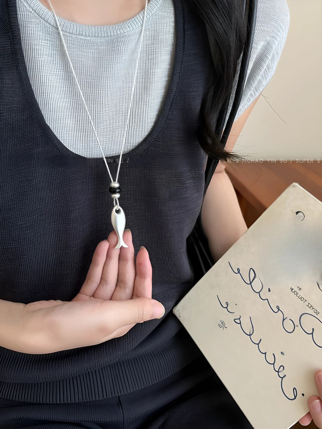 Silver white small fish pendant contrast black bead necklace