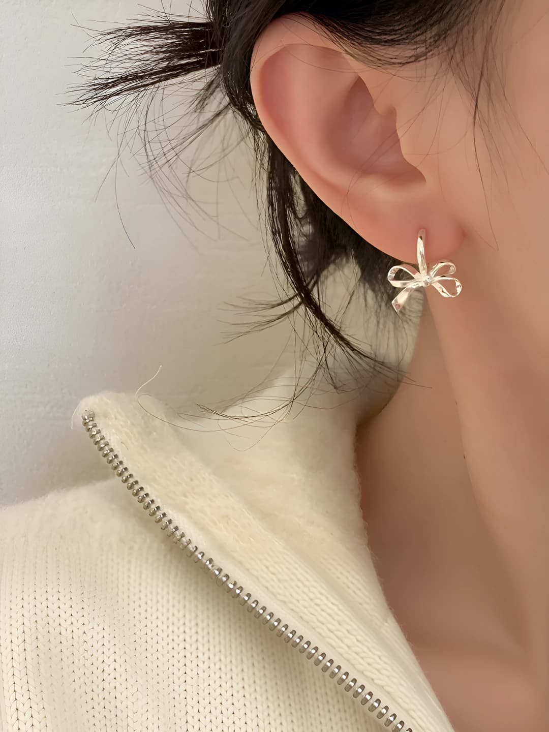 Women's bow earrings in sweet-cool style from a niche designer