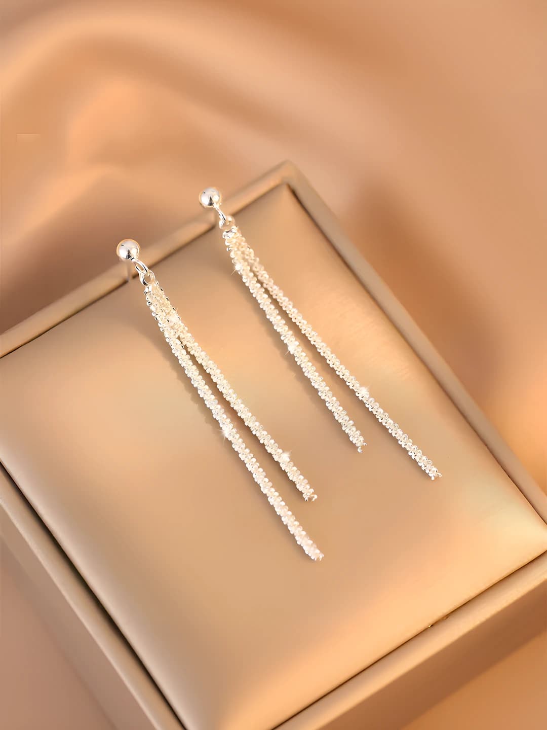 Gold shimmer tassel earrings A987