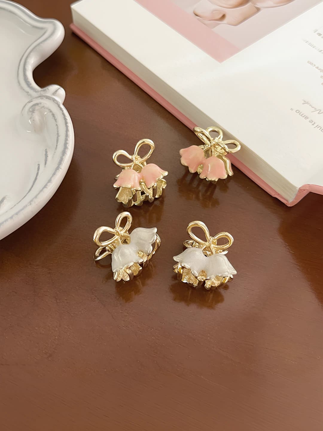 Women's mini metal hair claw clip with pink lily of the valley flower design