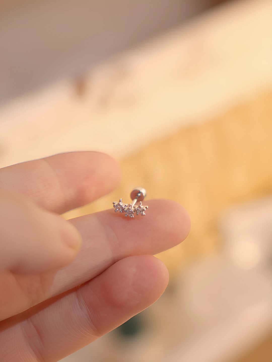 Three zircon moon spiral stud