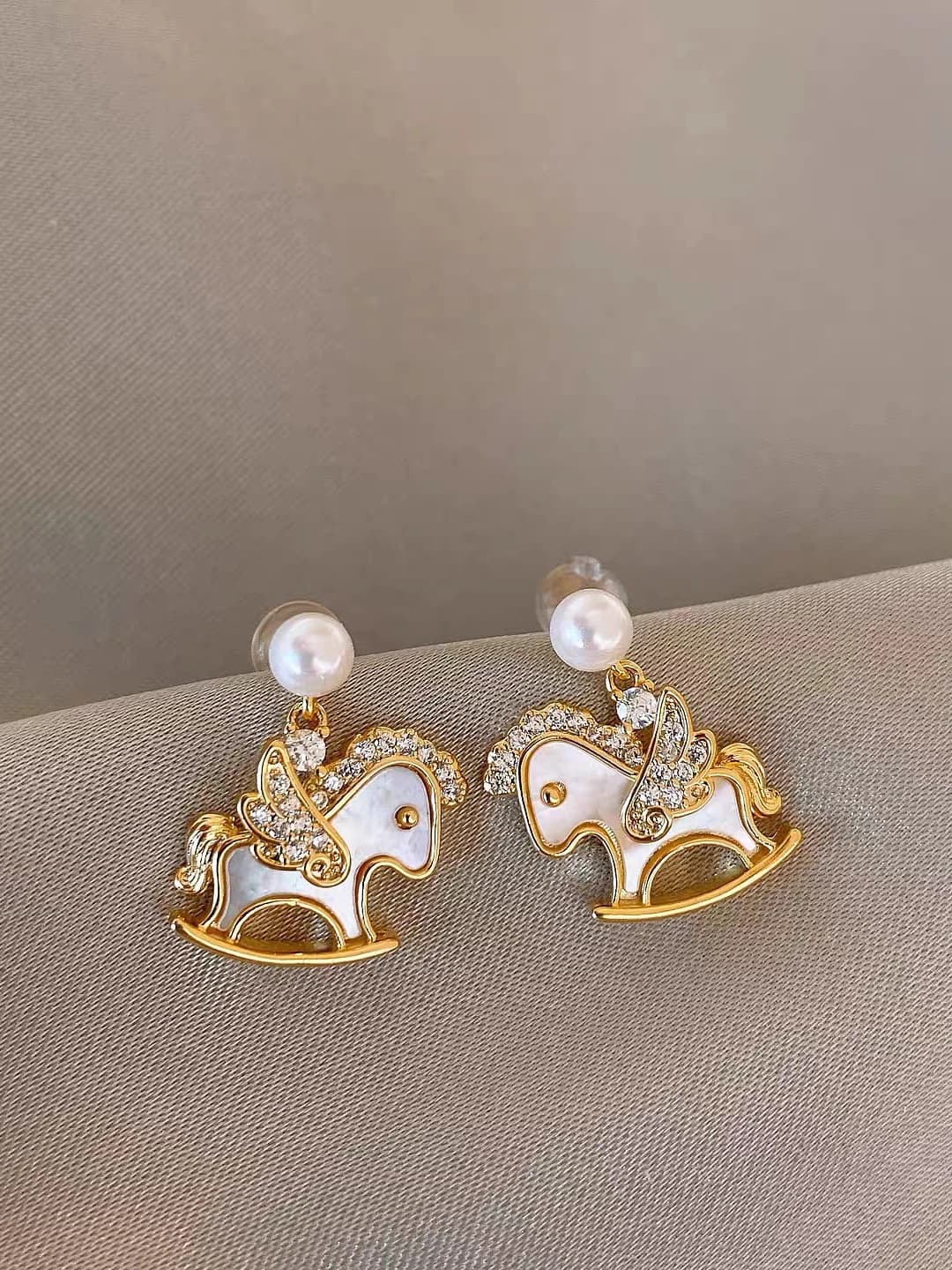 Shell and small horse stud earrings