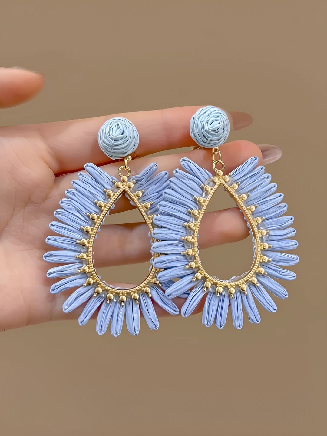 Blue openwork straw studs