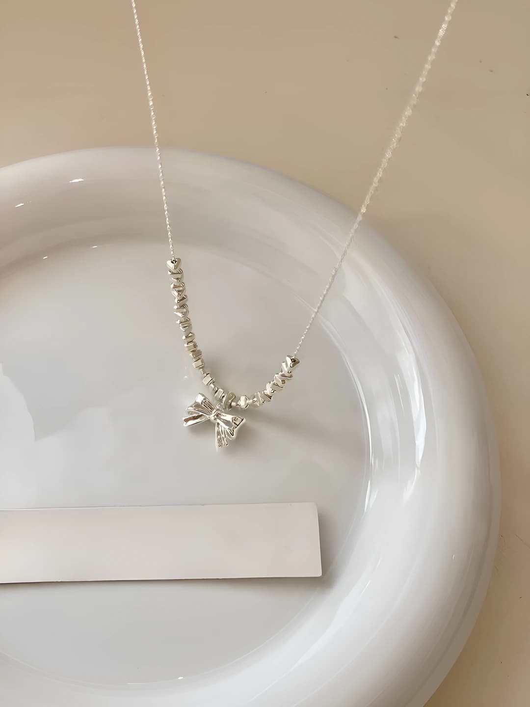 Women's 2026 ins style bow pendant necklace with gemstone, 41-50 cm length, 3 g weight, electroplated, cross chain