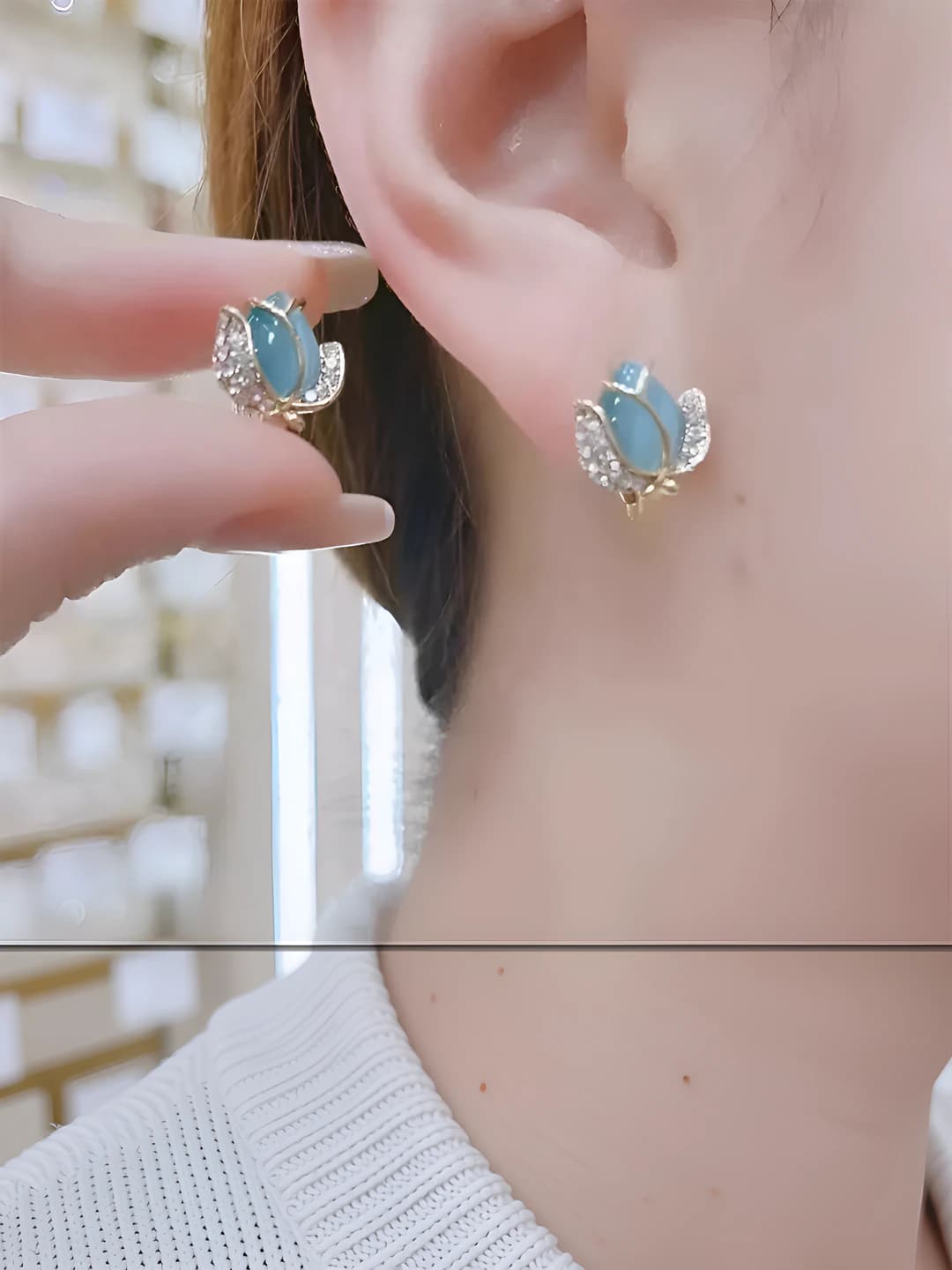 Women's silver stud earrings with cat's eye stone and tulip design