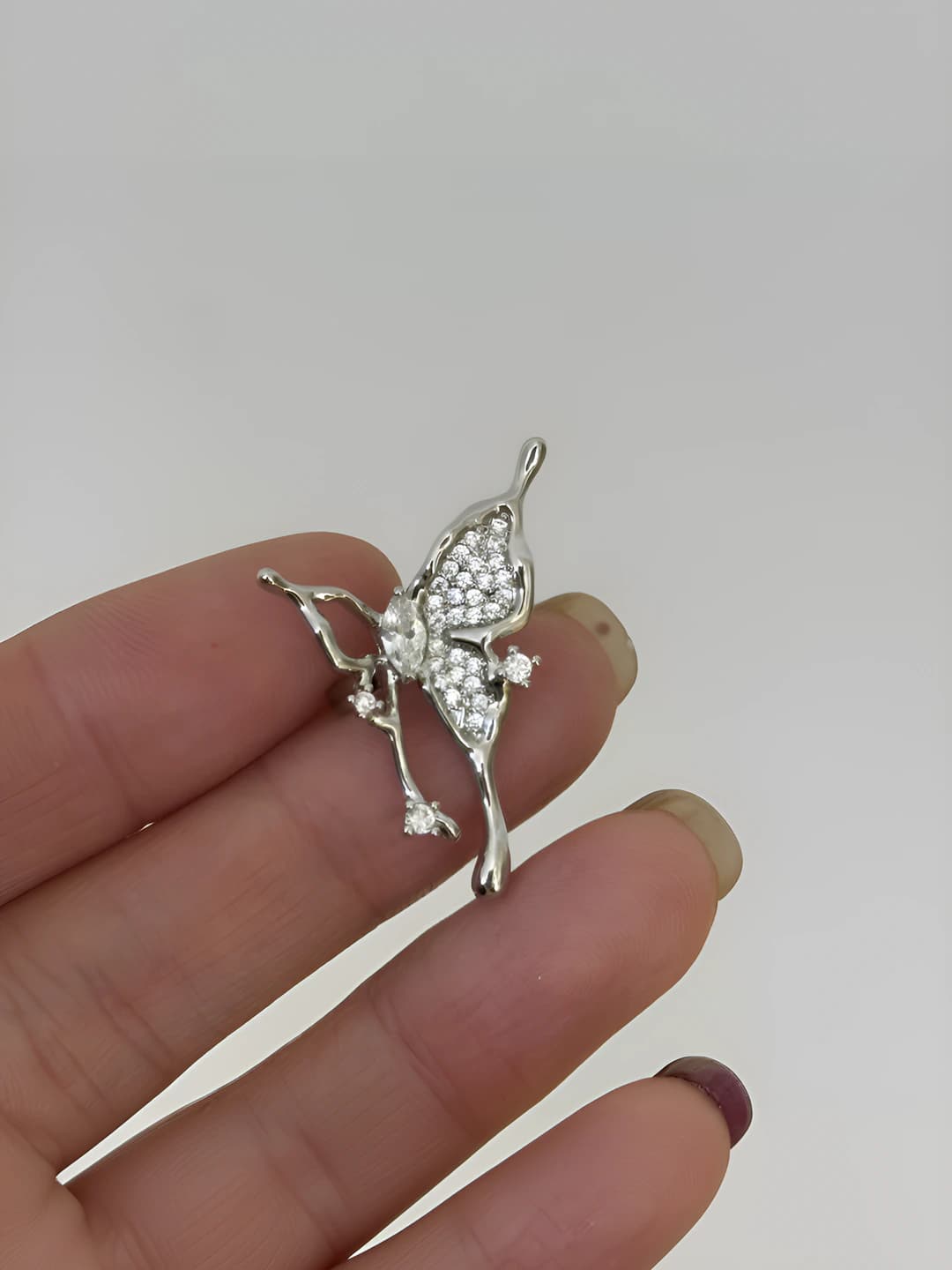 Butterfly zircon earring (left)