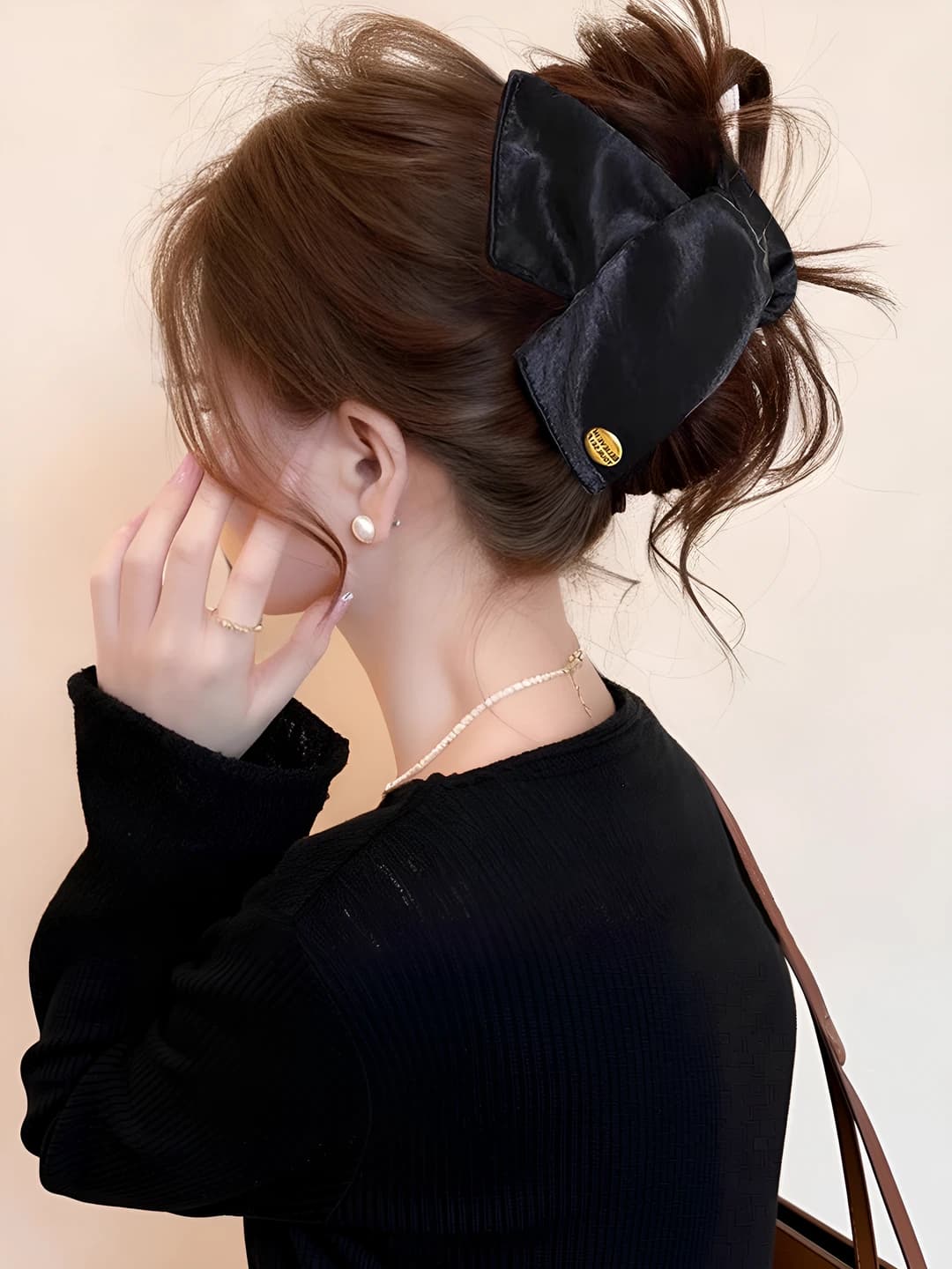Black satin gold logo triangle clip, ~13 cm
