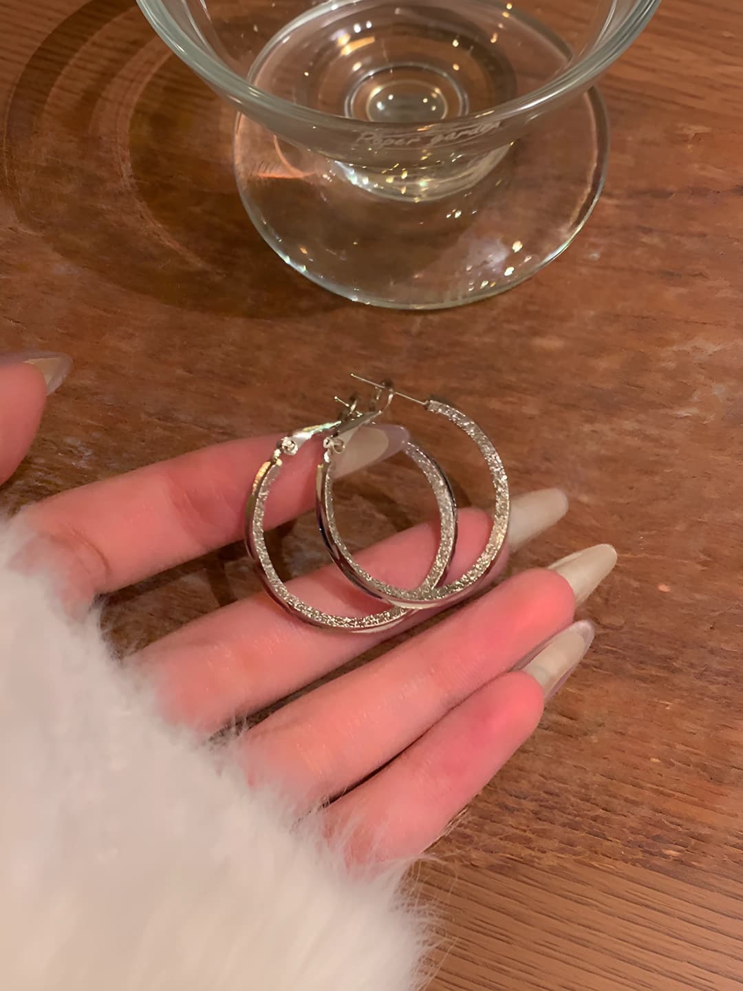 Women's large hoop earrings with geometric design, minimalist style