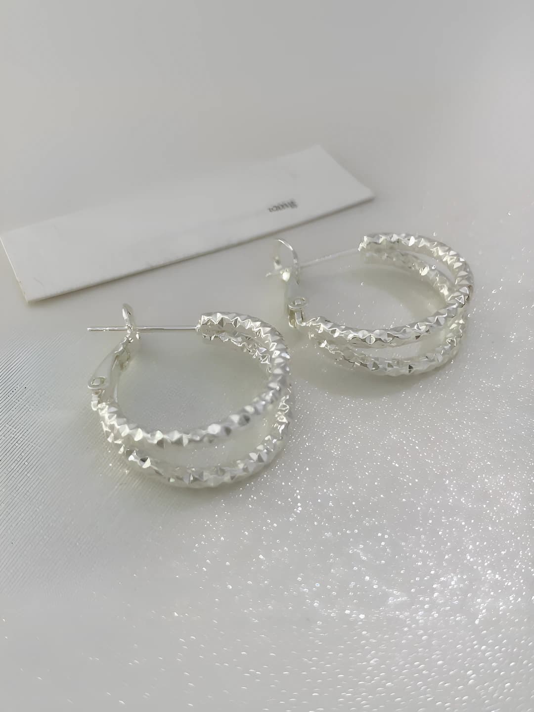 Silver icy ear studs