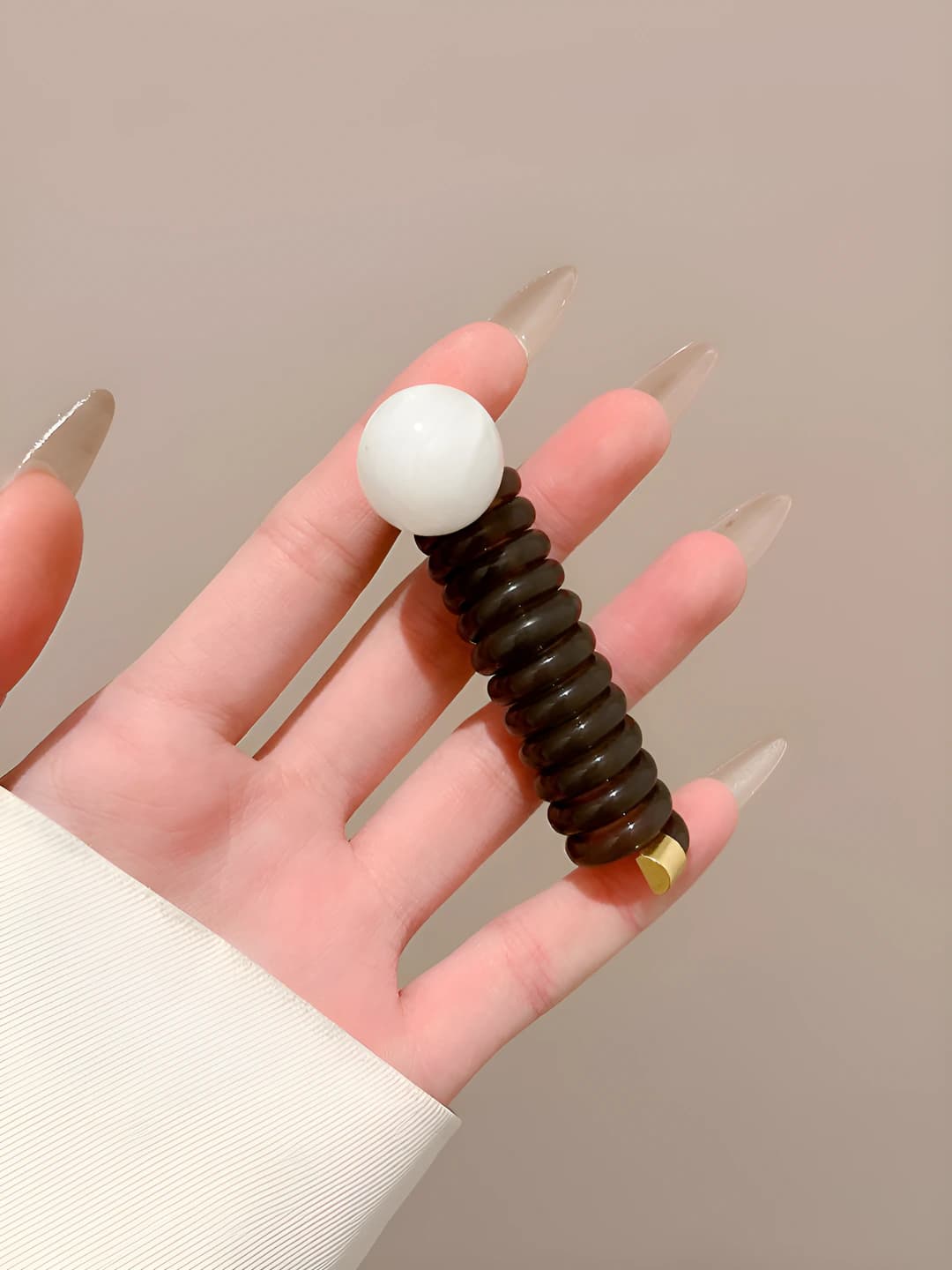 Brown, telephone cord, off-white pearls