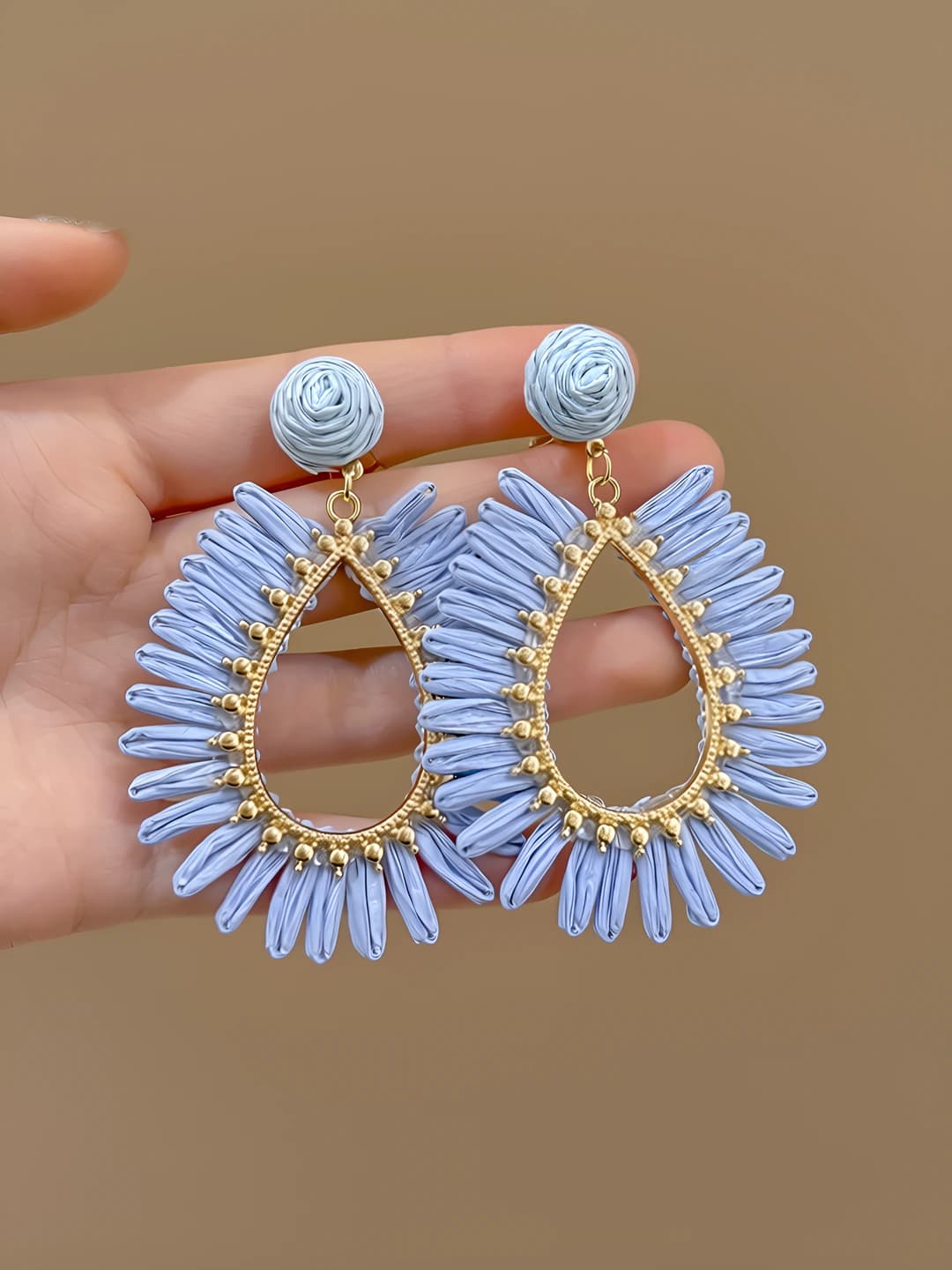 Blue openwork straw studs