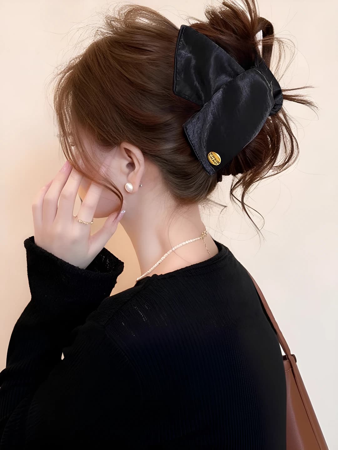Black satin gold logo triangle clip, ~13 cm