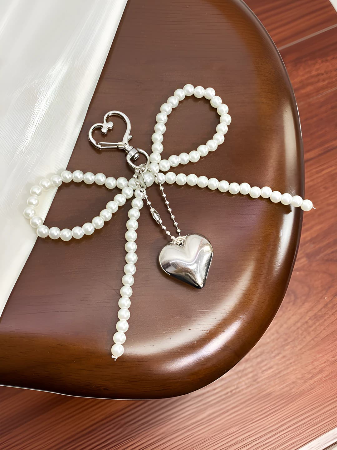 Pearl bow, silver heart