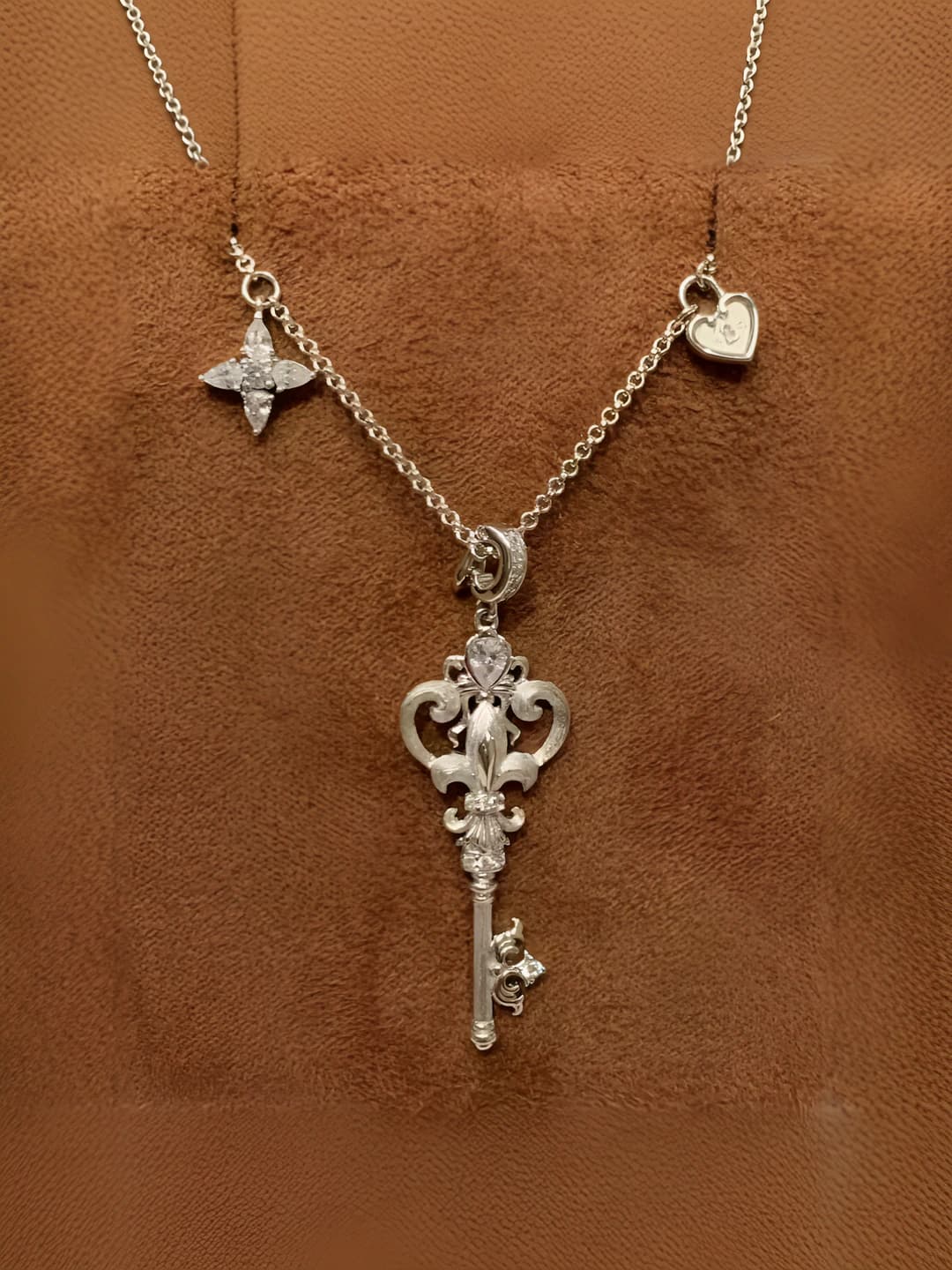 Women's necklace with key and iris pendant: copper and zircon, palace style, casual