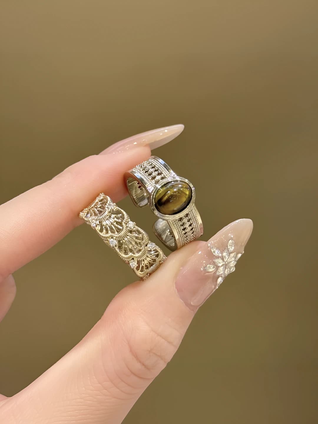 Women's ring with geometric shape, openwork carving, and faux tiger's eye stone