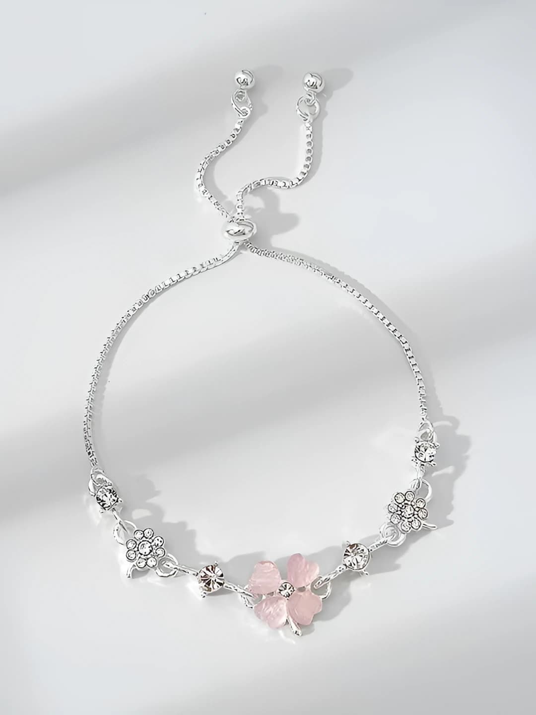 Bracelet: adjustable pink cat-eye clover