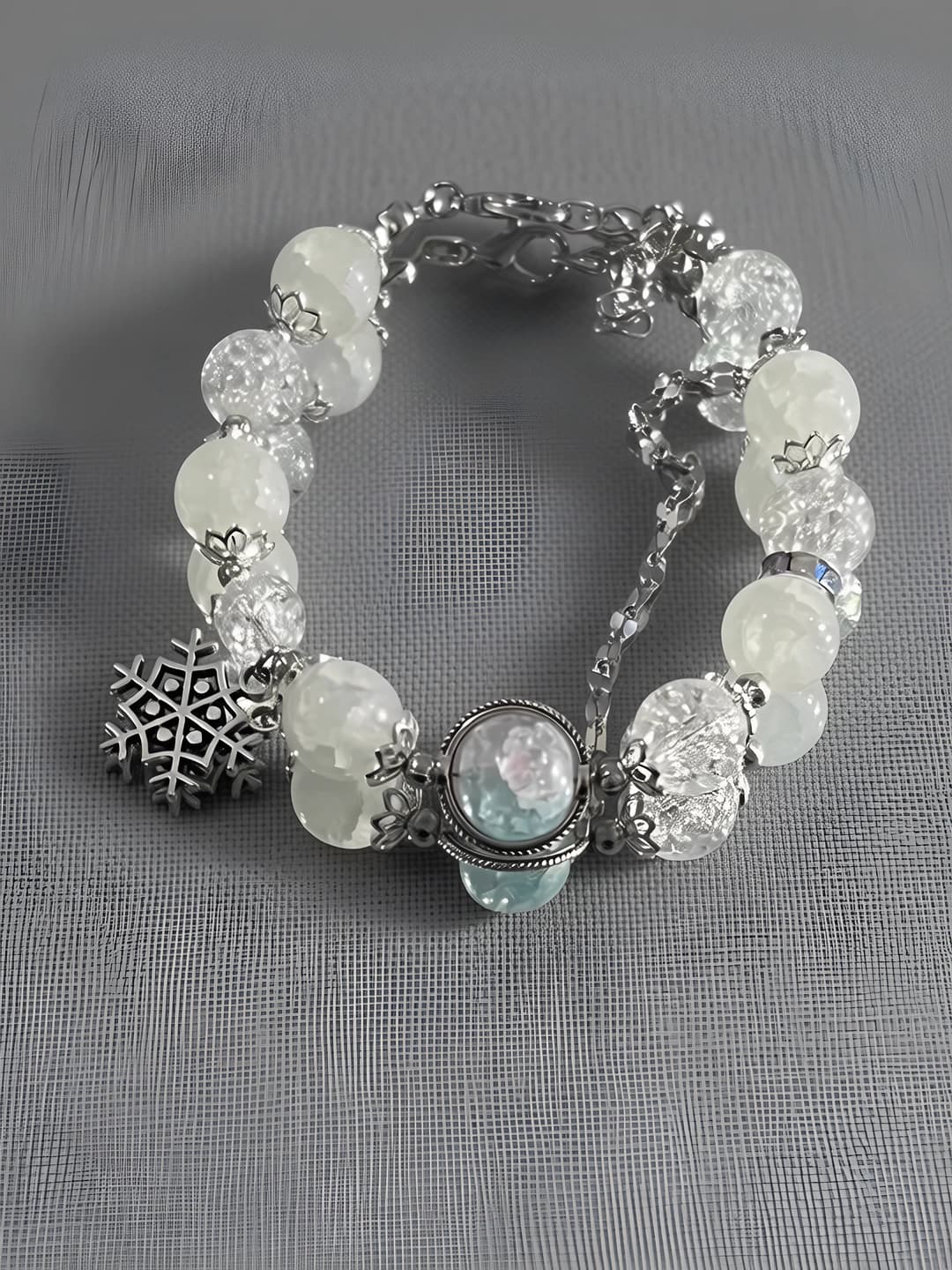 Women's white glass beaded bracelet with snowflake design
