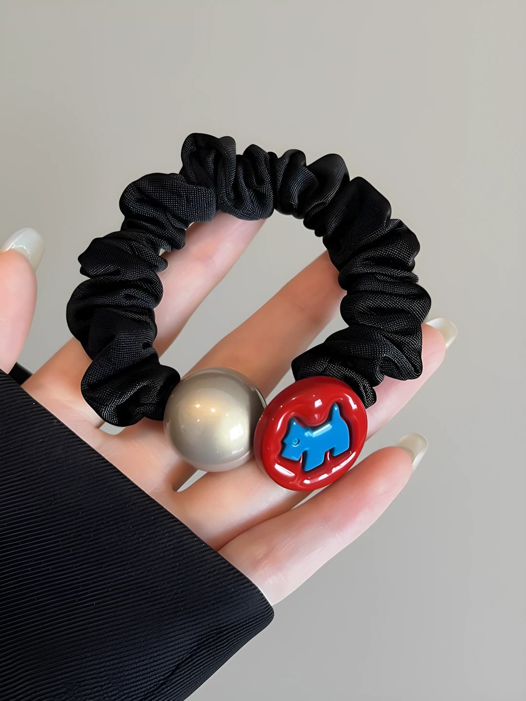 Blue dog, red button, pearl, black