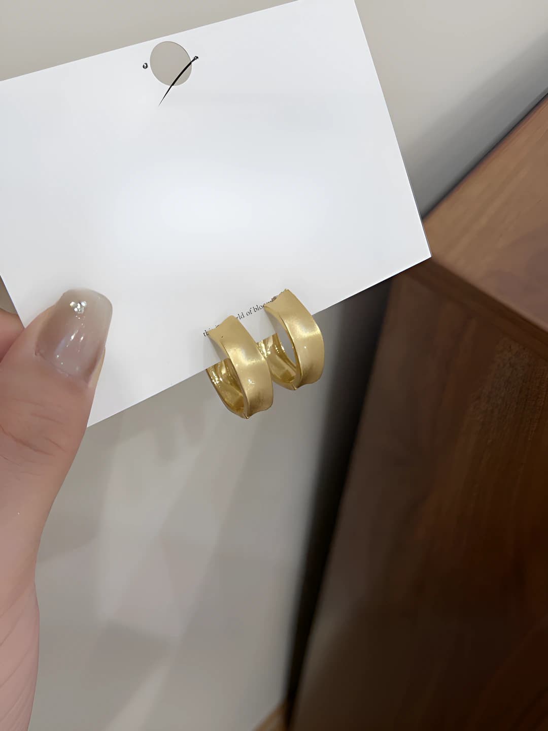 Women's gold geometric hoop earrings with irregular design, light luxury style