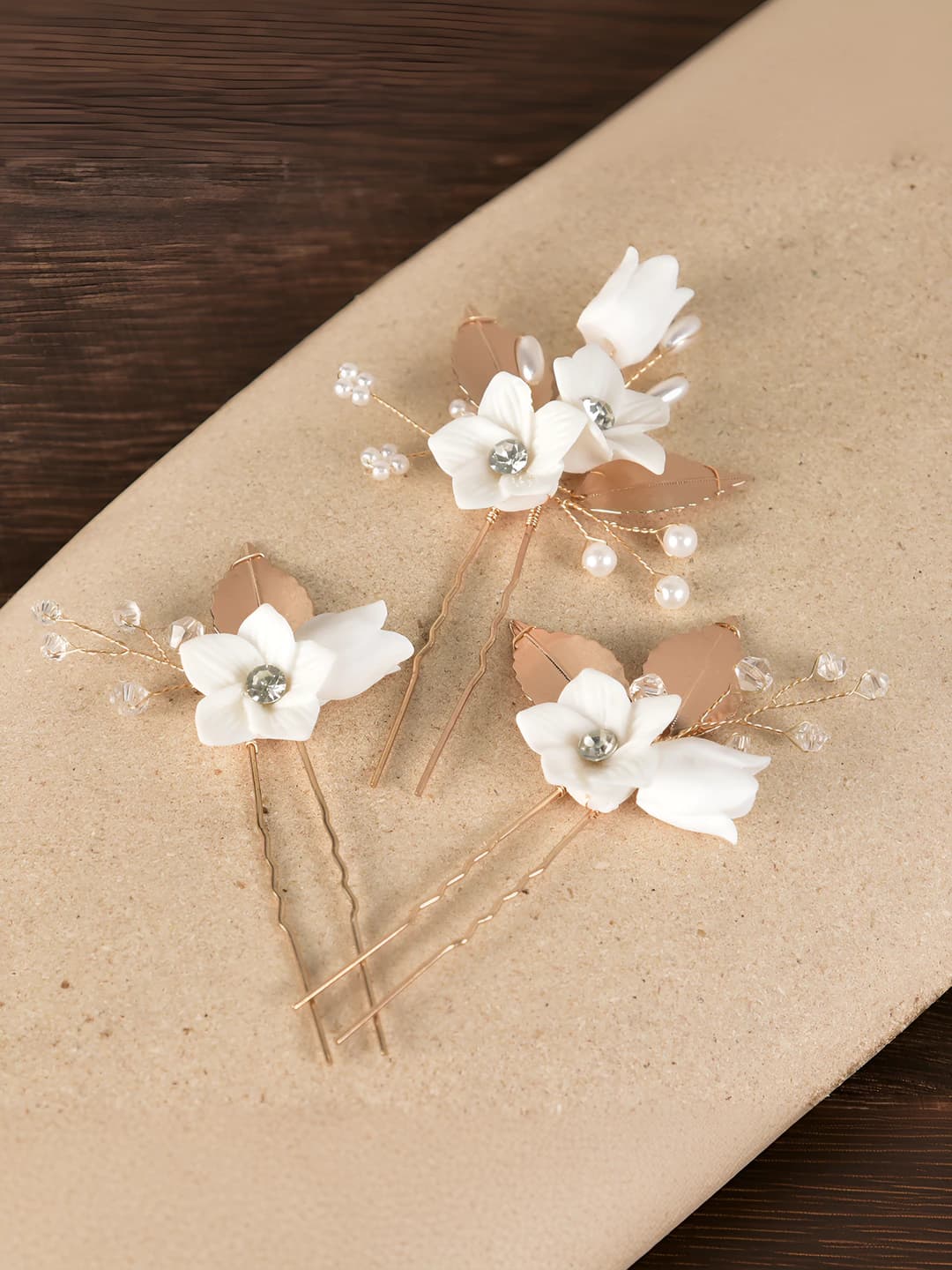 Women's hairpins and bobby pins with white ceramic flowers and leaves in French style