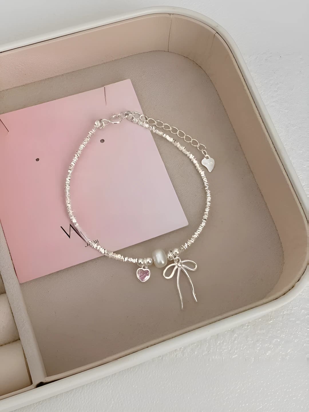 Women's Korean style bracelet with pink hearts, bows, pearls and silver beads