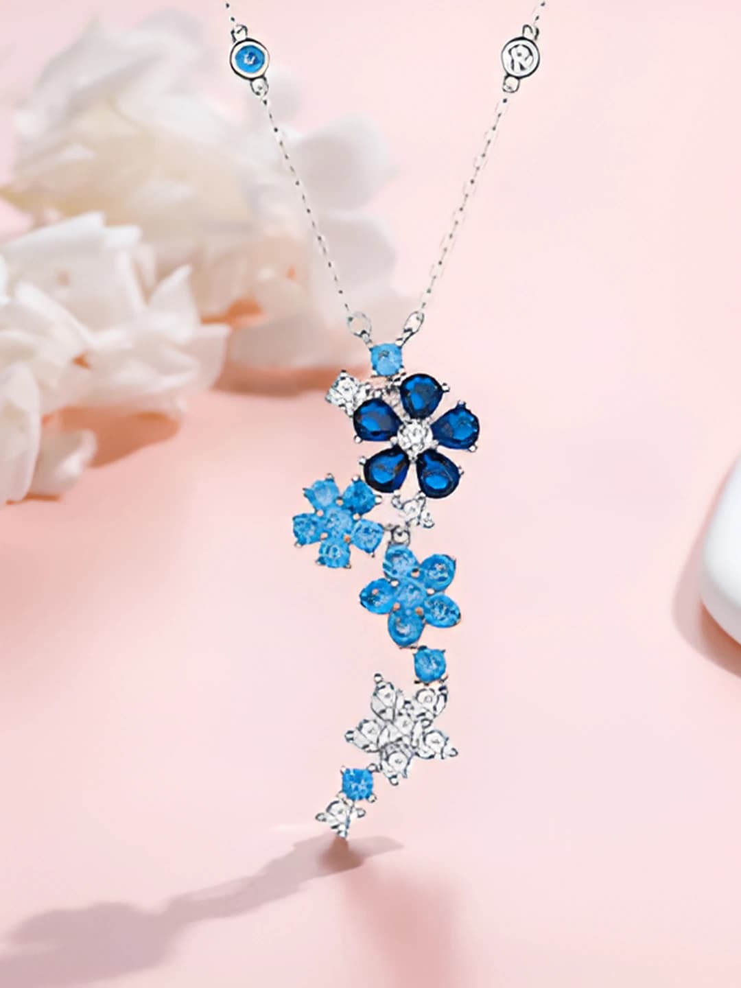 White gold, blue diamond necklace