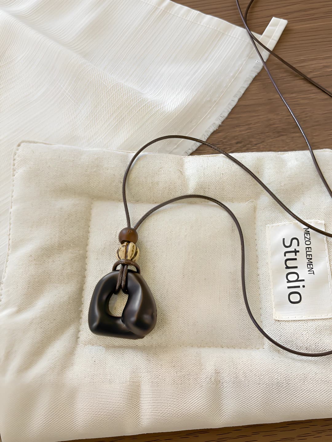 Coffee irregular cutout necklace