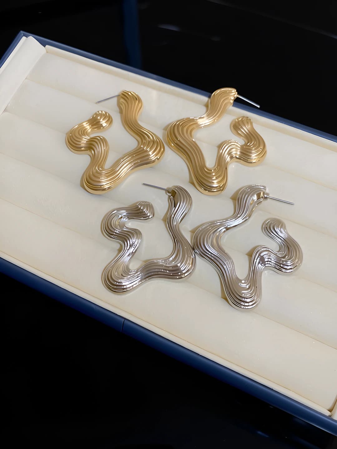 Women's metallic geometric design element earrings