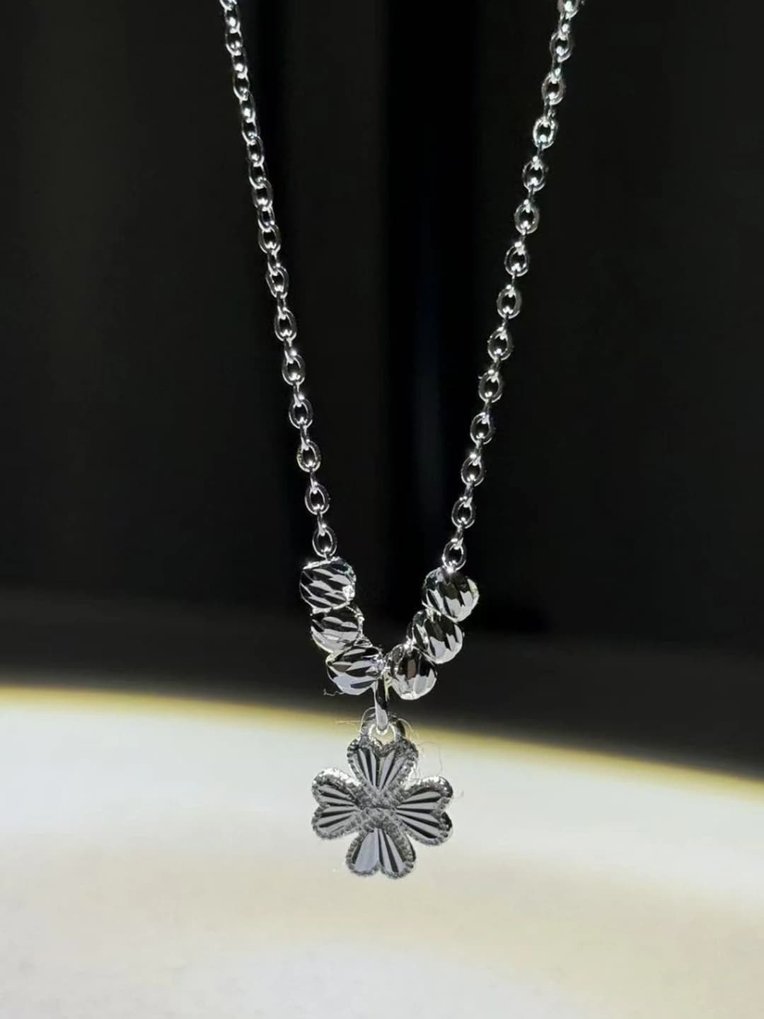 Women's brass pendant necklace with heart and four-leaf clover design, double-sided