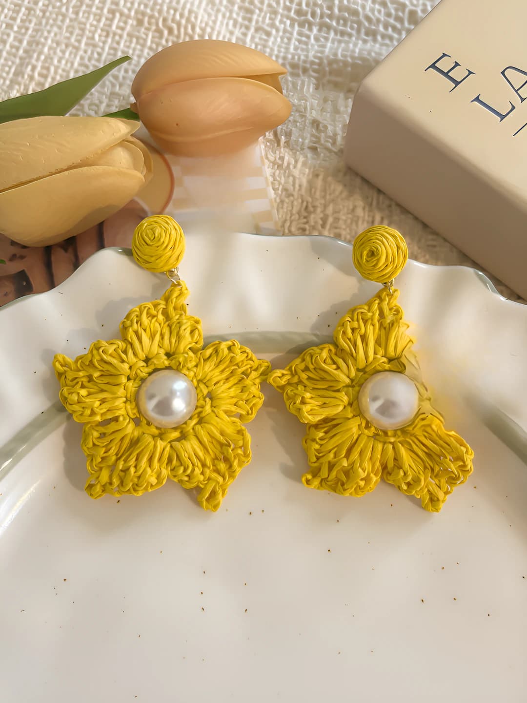 Yellow woven pearl star studs, 925