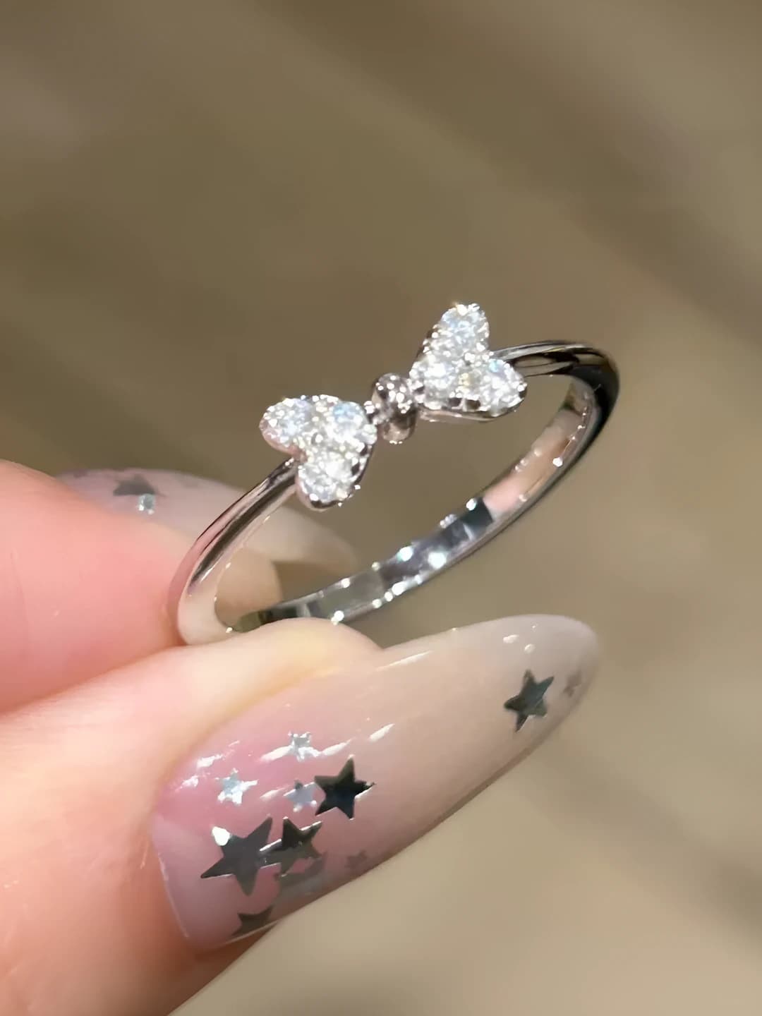 Women's adjustable ring with bow design in minimalist style