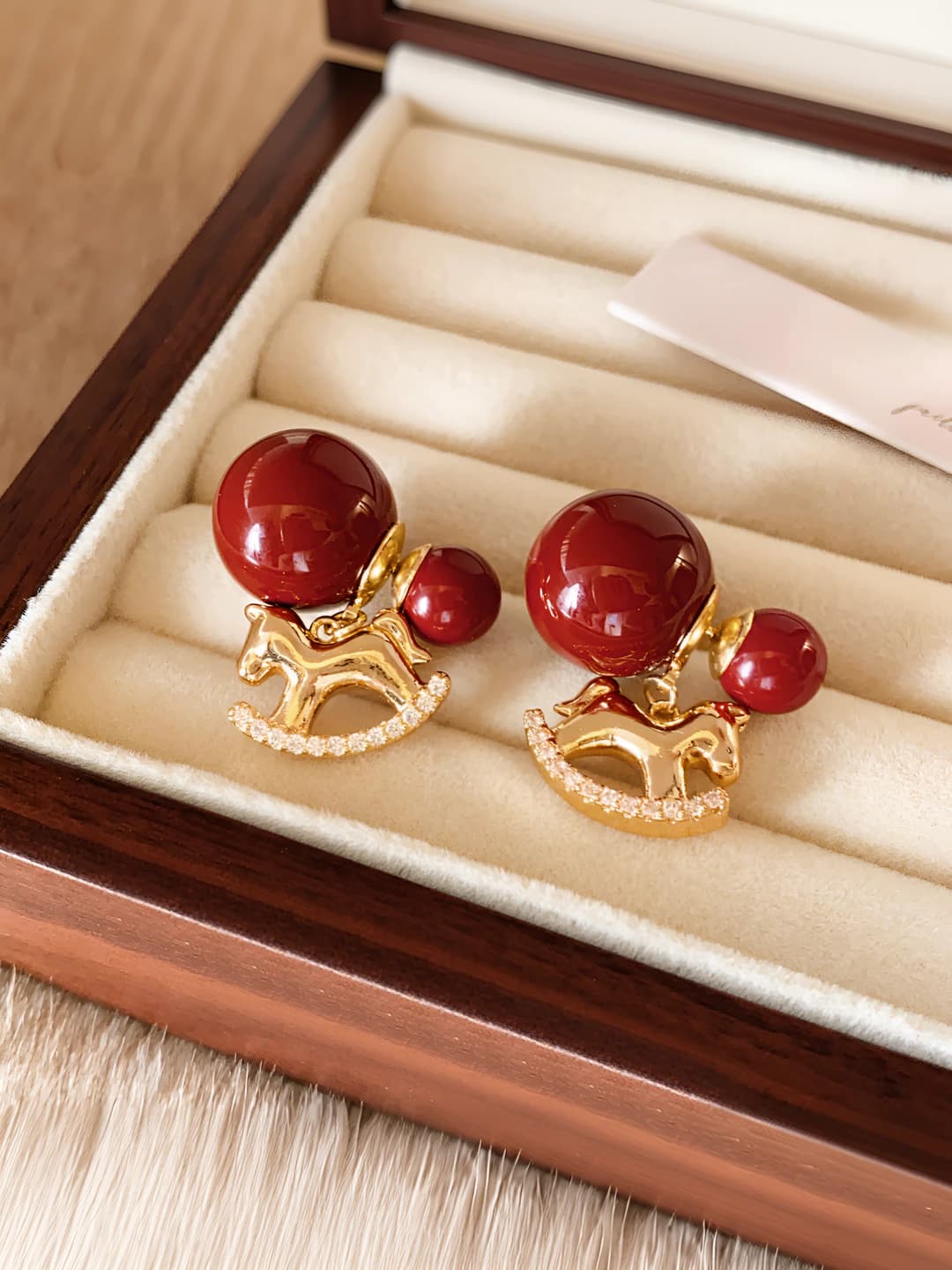 Red bead, gold horse, diamond