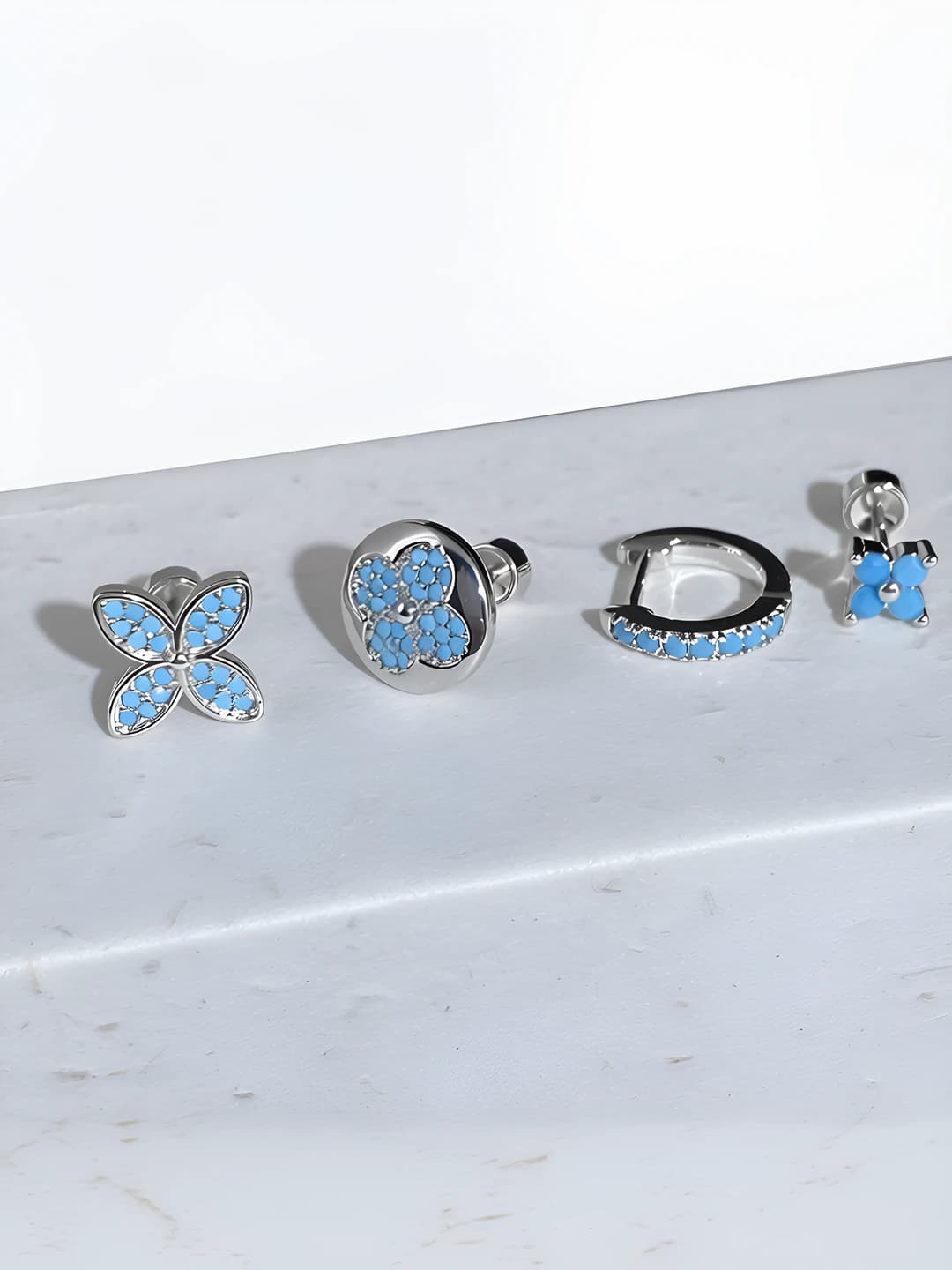 Women's titanium steel earrings with full diamond coverage and four-leaf flower design