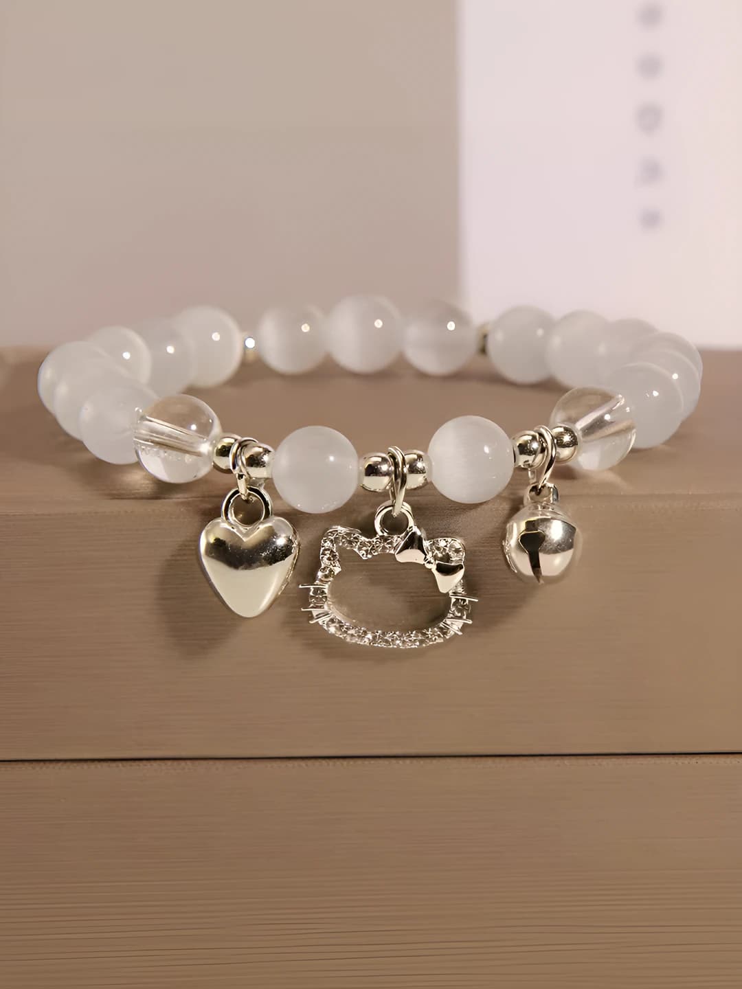 Women's beaded bracelet with charms in cartoon style
