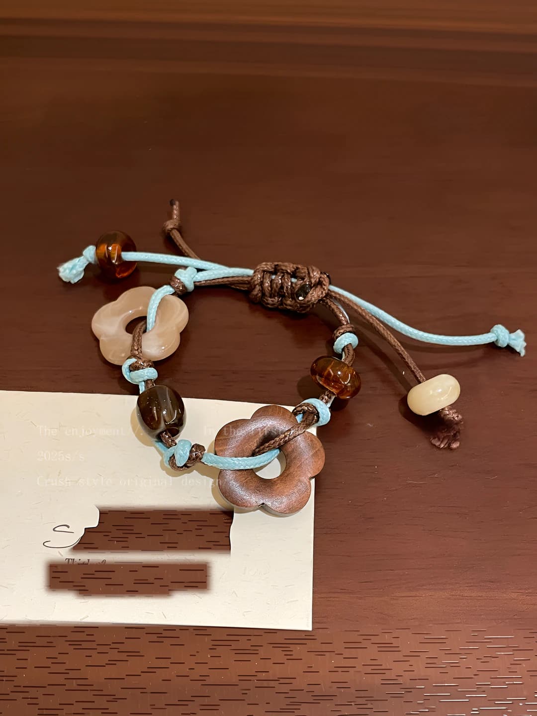 Women's braided rope bracelet with floral pattern in retro style