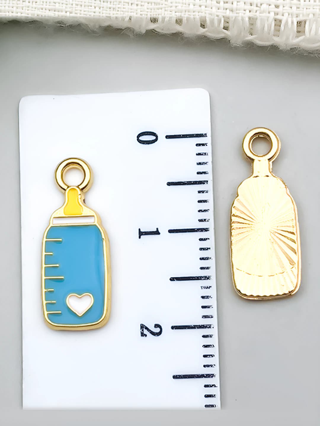 1 pc teal with scale, baby bottle 18x7mm-0.6g