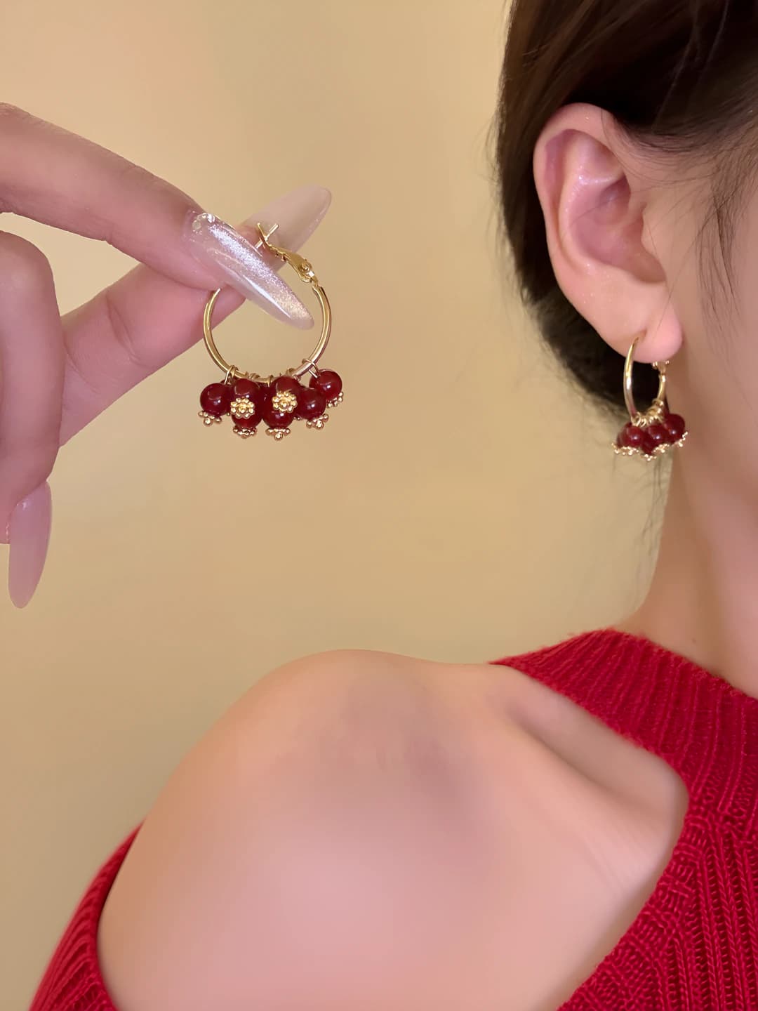 Women's red beaded heart-shaped earrings with floral design in light luxury style