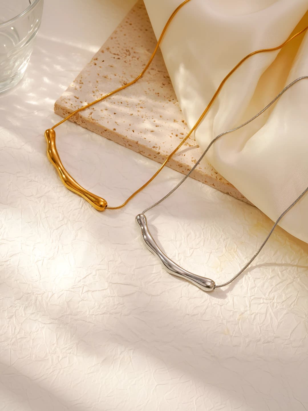 Women's stainless steel necklace with geometric pendant and 18K gold plating