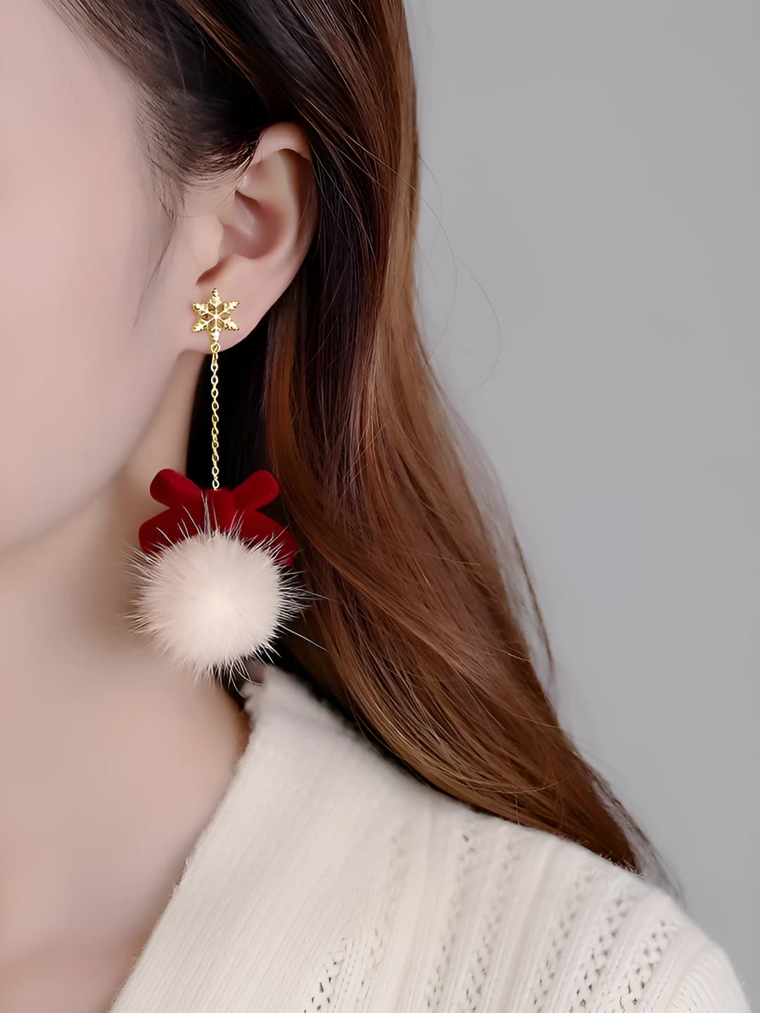 Long bow pom-pom stud earrings