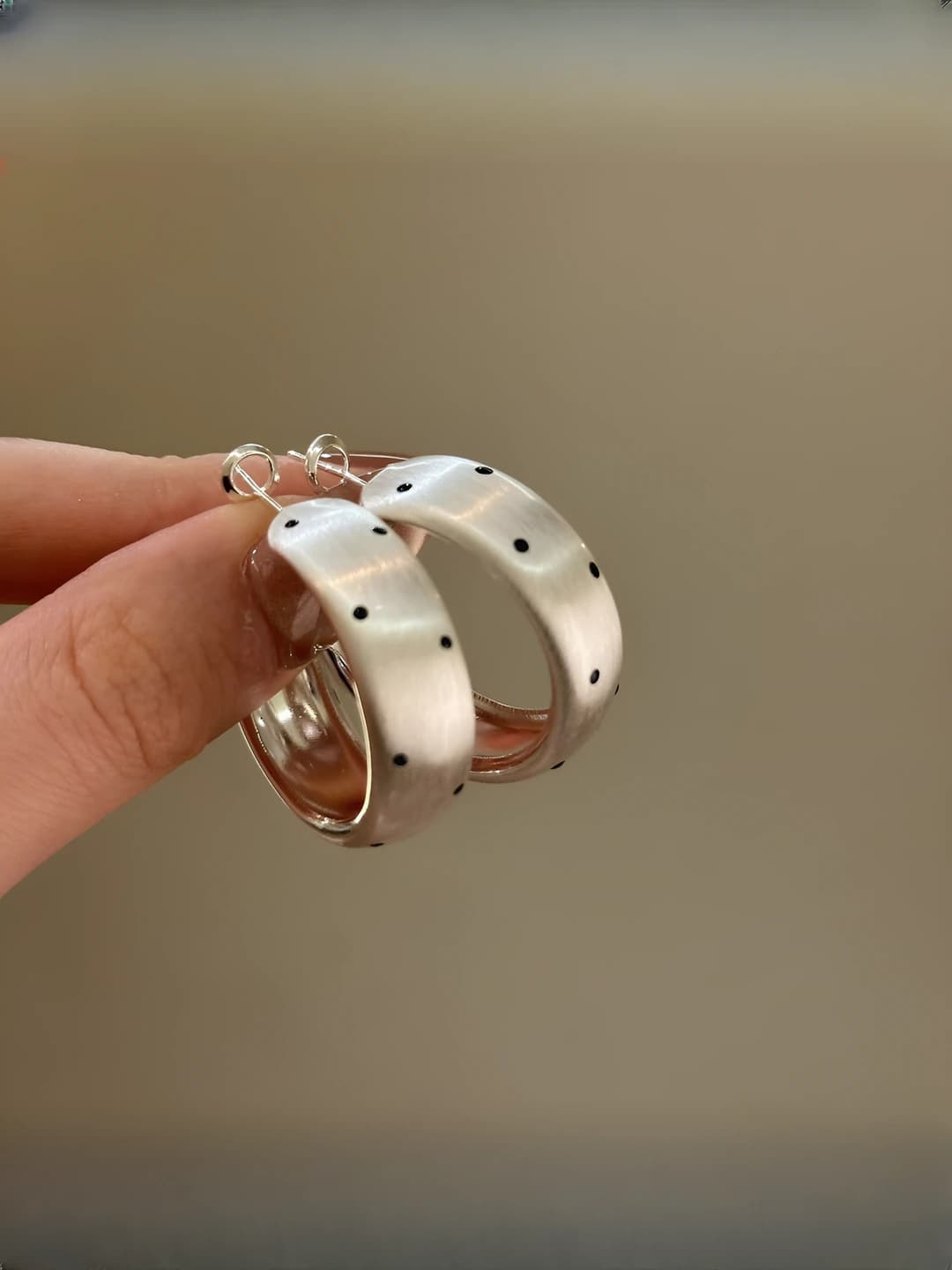 Silver brushed black dot earrings