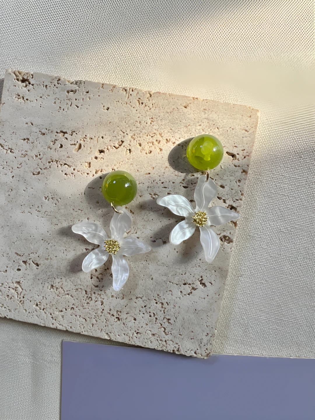 Women's romantic forest style stud earrings with contrasting white flower petals
