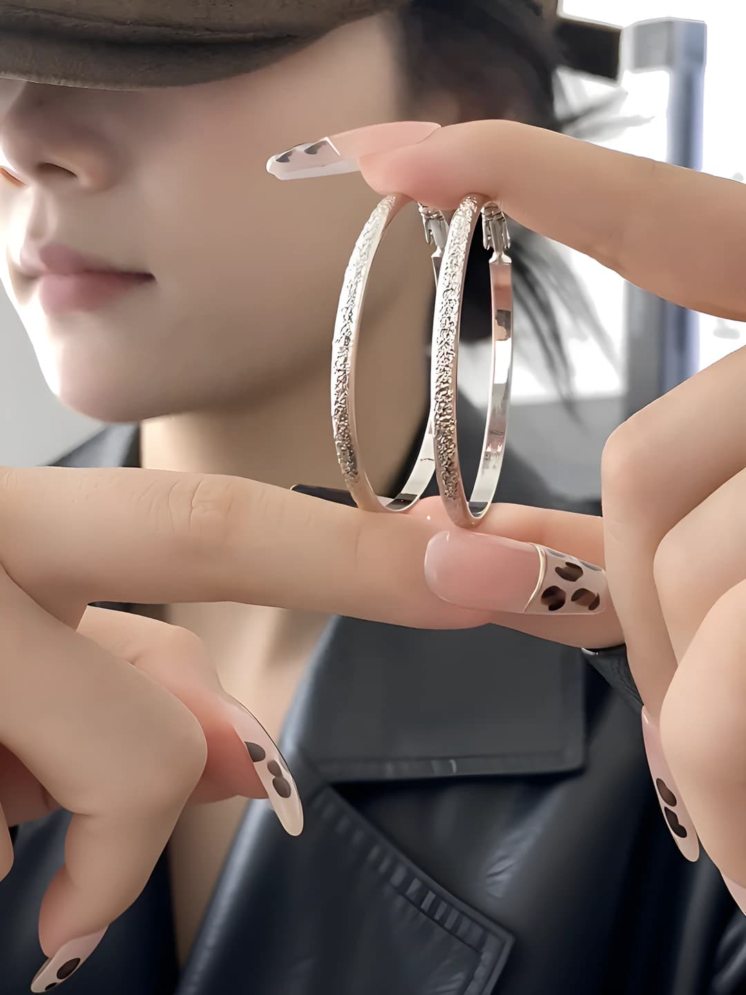 Women's silver hoop earrings, geometric design element, luxury style