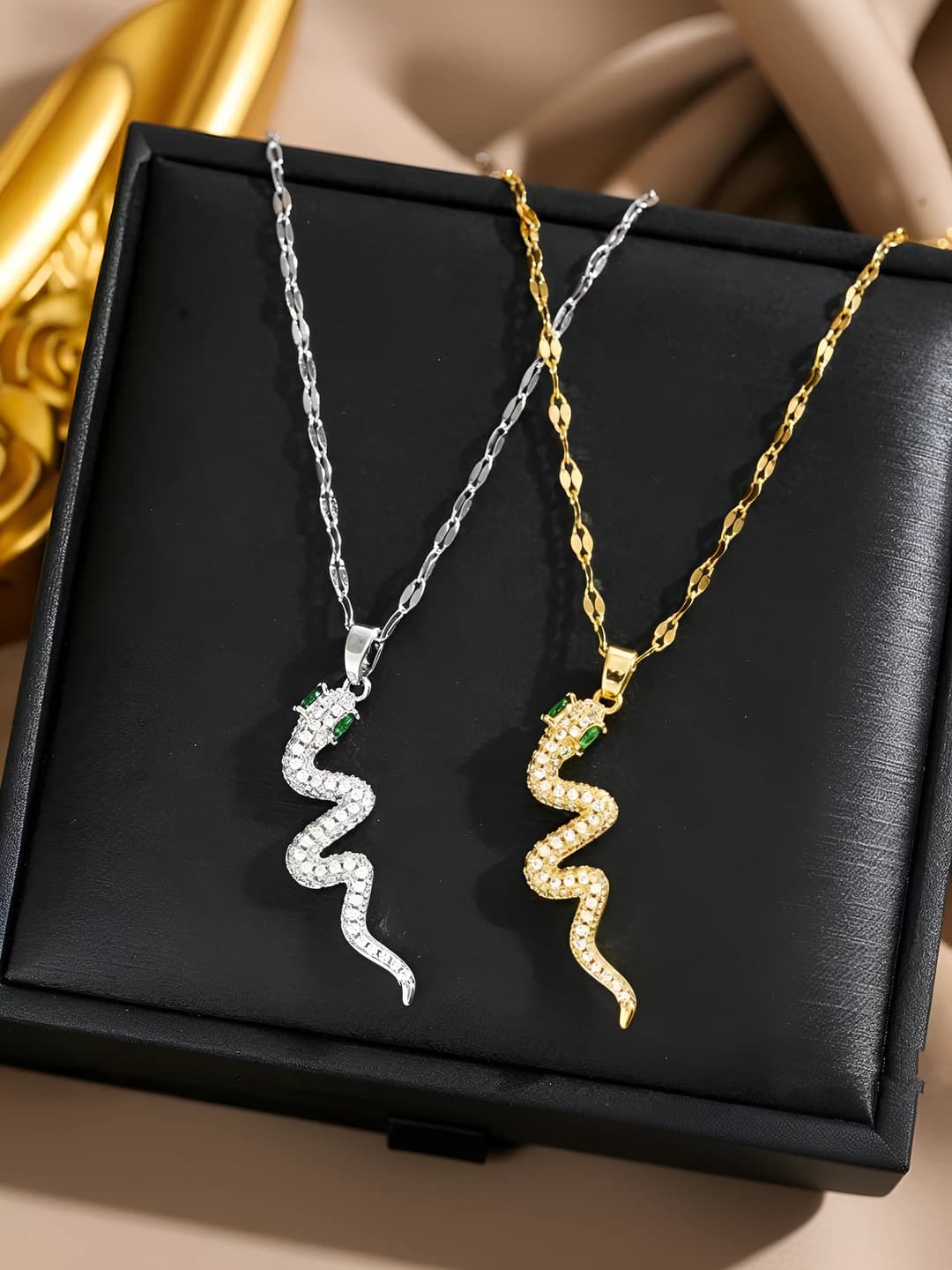 Women's titanium steel chain necklace with green-eyed snake pendant and small zircons