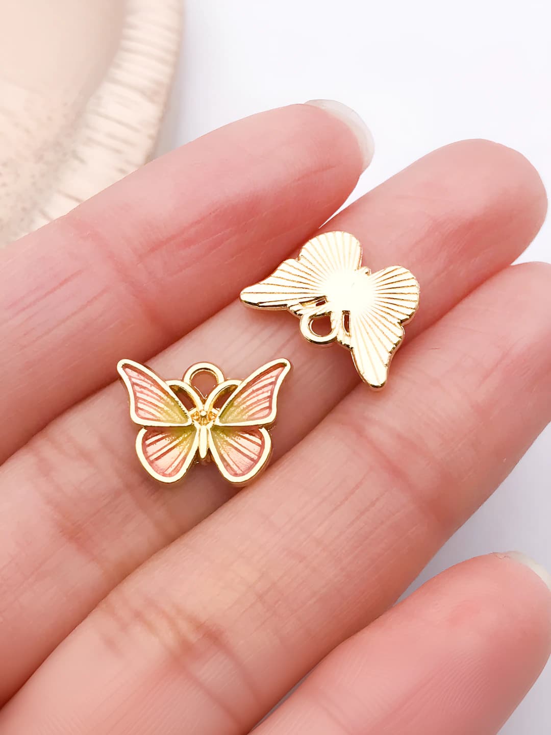 1 pc Small pink-yellow butterfly 10x14mm-0.9g