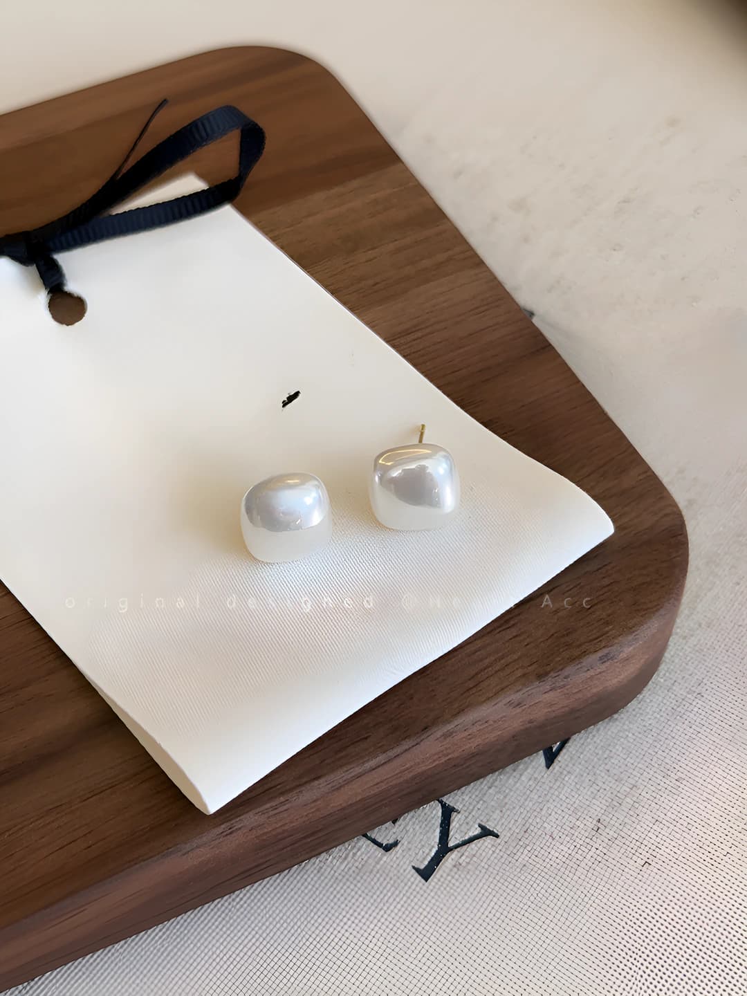White stud earrings